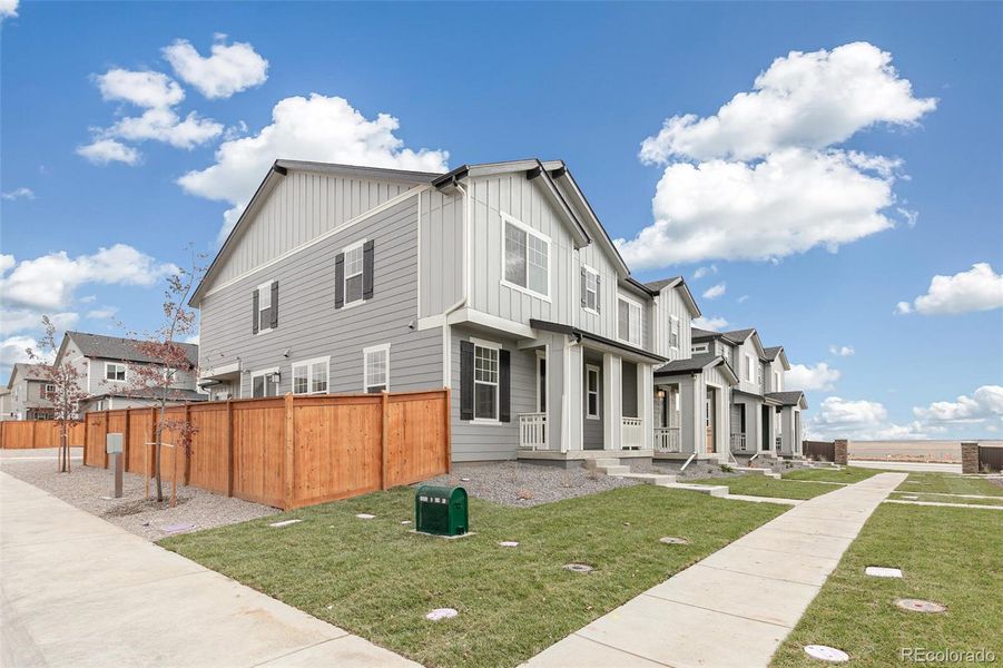 Exterior details and patio area of a home in Sky Ranch Villas, Watkins (Image 21).