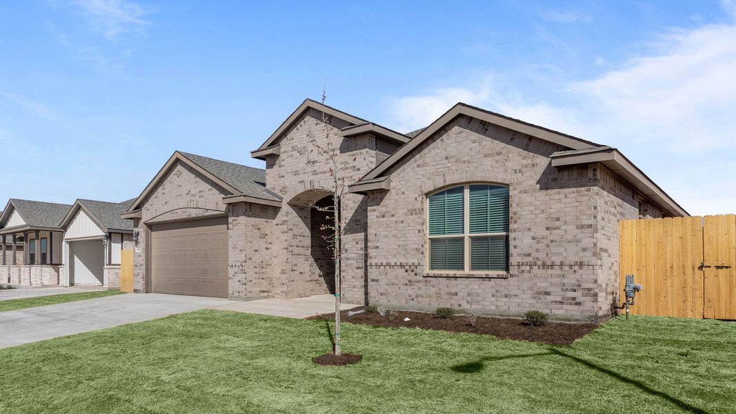 Representative exterior photo of a completed home built from the LAKEMONT by D.R. Horton in Northwest Passage, Midland, TX (Image 16). Representative exterior photo of a completed home built from the LAKEMONT by D.R. Horton in Northwest Passage, Midland, TX (Image 16).