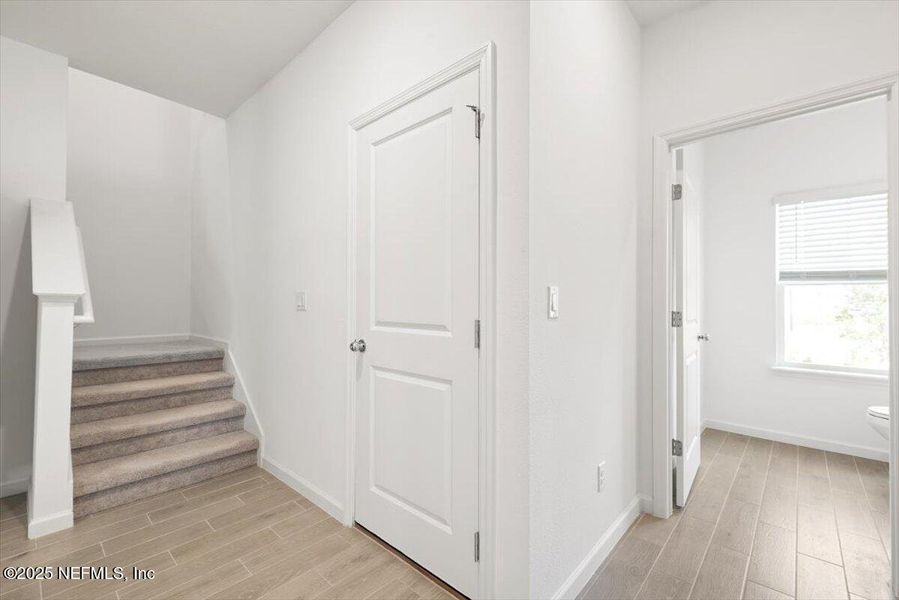 Spacious, unfurnished interior of a new home in Hardwick Farms: Hardwick Farms - Townhome Collection, Jacksonville (Image 23).