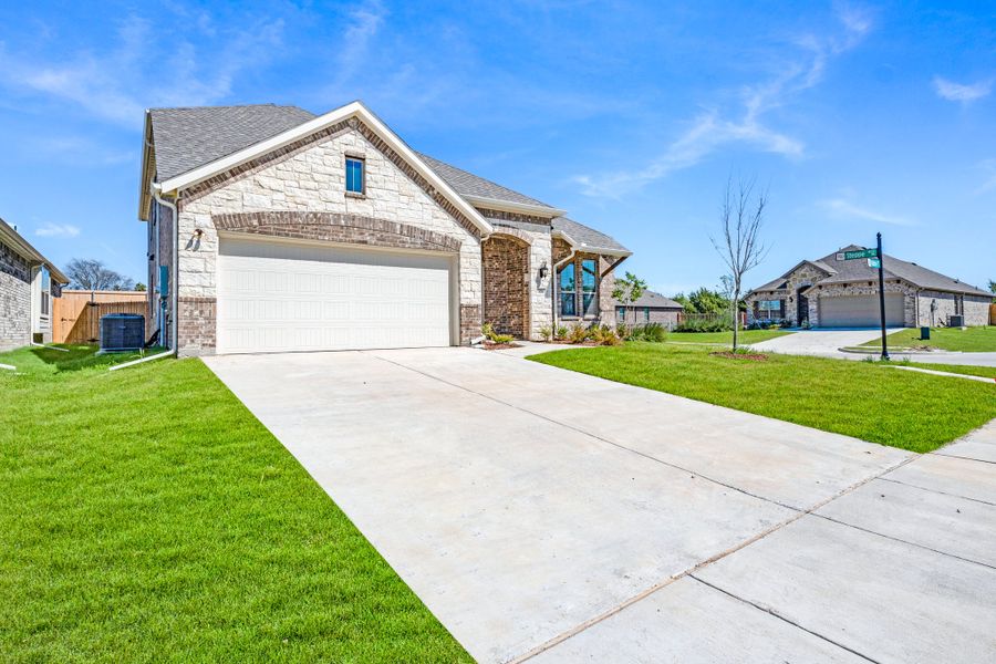 Front exterior of a new home in Summerwood, Red Oak, TX, highlighting curb appeal (Image 22).