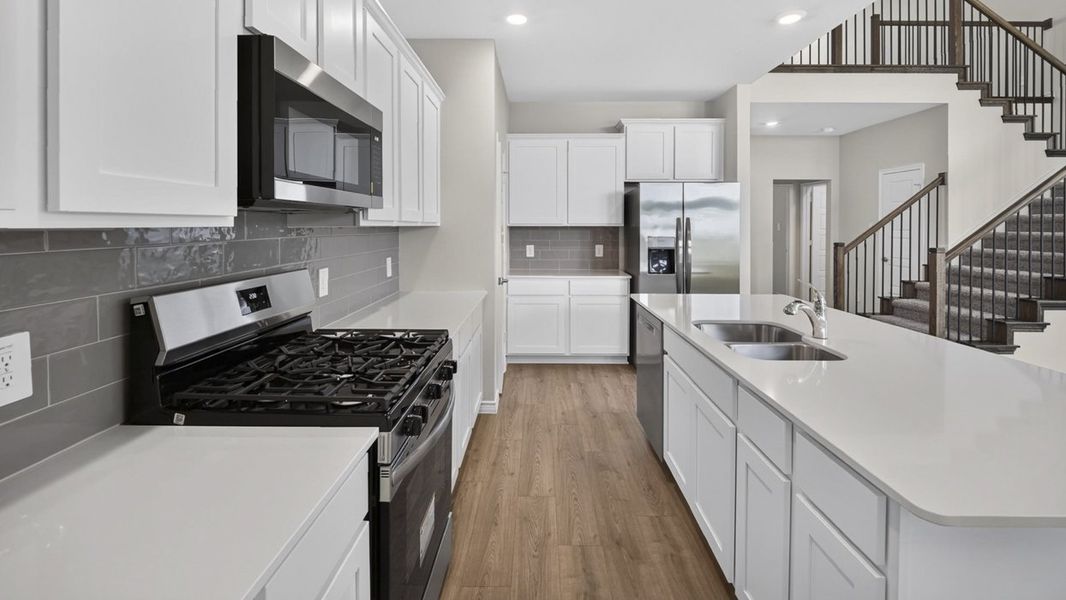 Representative furnished interior of a home built from the H233 Alpine by D.R. Horton in Lilybrooke at Legacy Hills, Celina (Image 3).