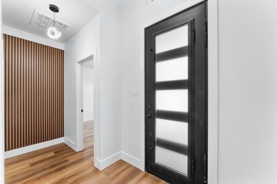 Foyer featuring light wood-style floors and baseboards Foyer featuring light wood-style floors and baseboards