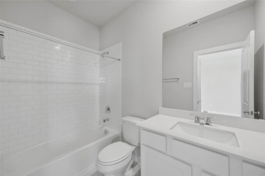 Furnished interior view inside a new home in Sunterra 40, Katy (Image 8).