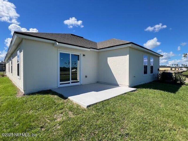 Exterior details and patio area of a home in Sawmill Branch Express, Palm Coast (Image 3). Exterior details and patio area of a home in Sawmill Branch Express, Palm Coast (Image 3).