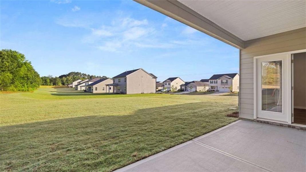 Exterior details and patio area of a home in Preserve at Dove Creek, Statham (Image 27).
