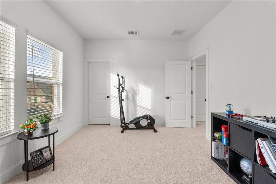 Upstairs secondary bedroom.