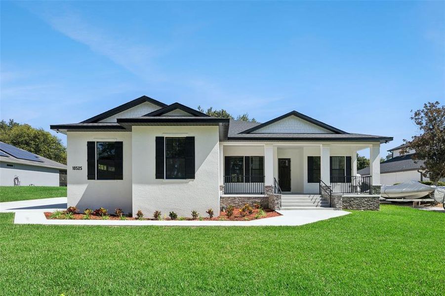 Front exterior of a new home in , Clermont, FL, highlighting curb appeal (Image 25).