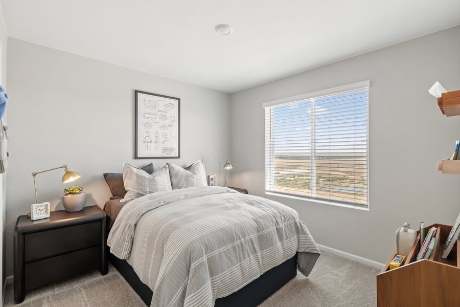 Representative furnished interior of a home built from the 2403 by Risewell Homes in Harvest Crossing, Aurora (Image 7).