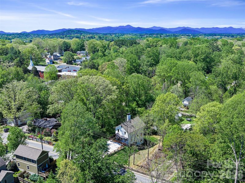 Home in center with drone view south west to mountains