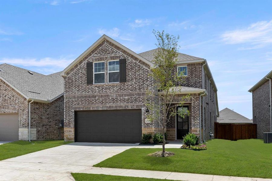 Front exterior of a new home in Creekview Fossil Ridge, Pilot Point, TX, highlighting curb appeal (Image 18). Front exterior of a new home in Creekview Fossil Ridge, Pilot Point, TX, highlighting curb appeal (Image 18).
