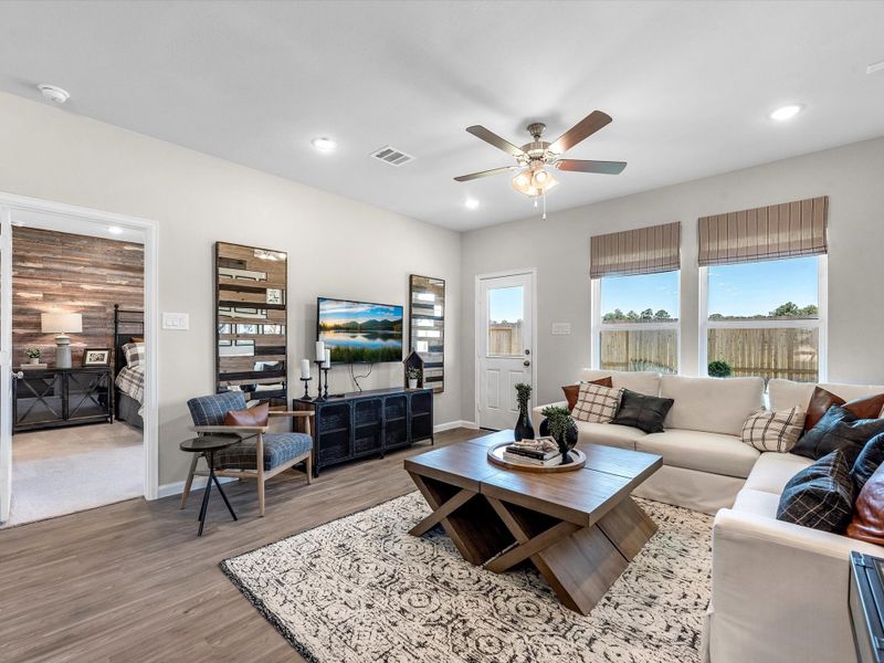 A living room with a large window. A living room with a large window.