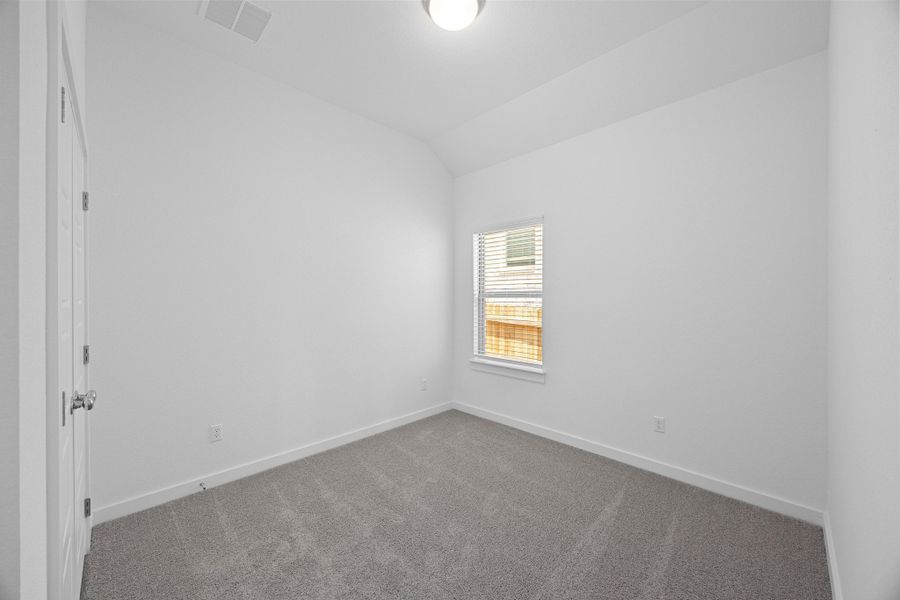 Bedroom in the Pecan II home plan by Trophy Signature Homes – REPRESENTATIVE PHOTO