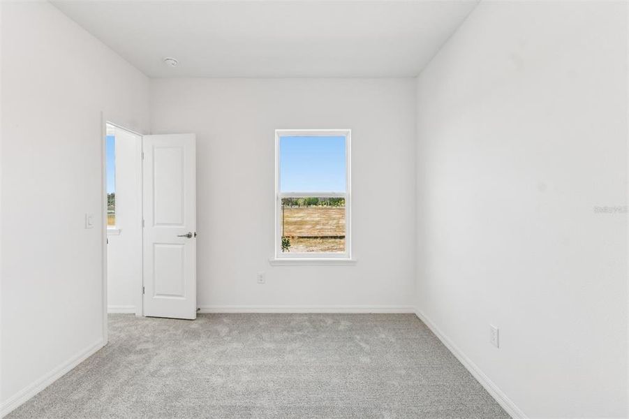 Spacious, unfurnished interior of a new home in Laureate Park at Lake Nona - Garden Series, Orlando (Image 28).
