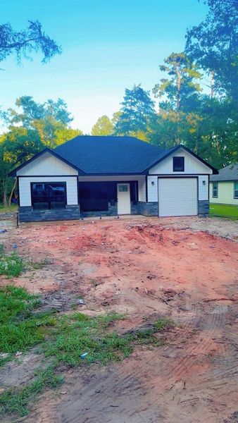 Front exterior of a new home in , Willis, TX, highlighting curb appeal (Image 22). Front exterior of a new home in , Willis, TX, highlighting curb appeal (Image 22).