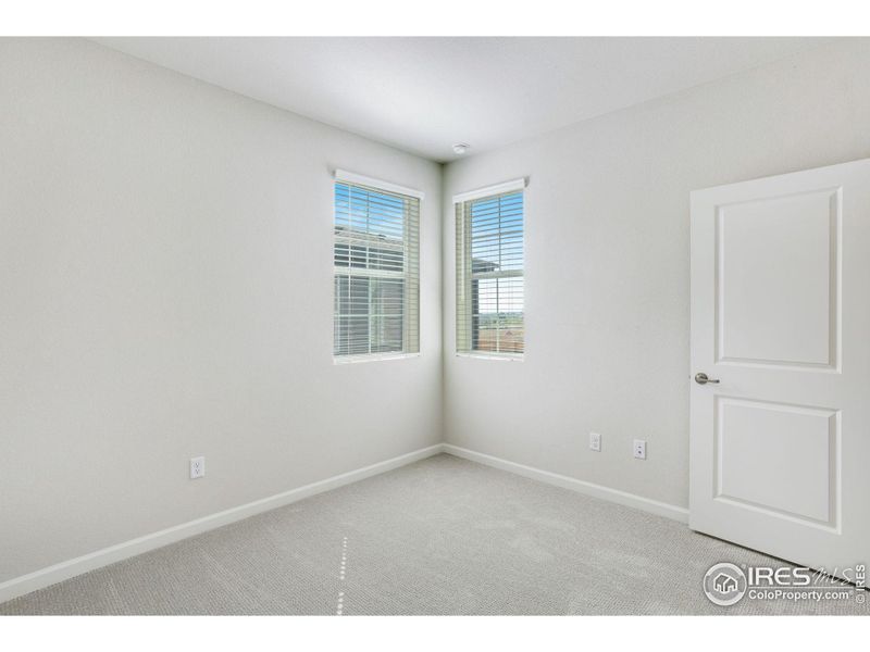 Spacious, unfurnished interior of a new home in Westside Crossing Townhomes, Berthoud (Image 25).