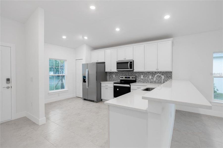 Furnished interior view inside a new home in , Port Charlotte (Image 5). Furnished interior view inside a new home in , Port Charlotte (Image 5).