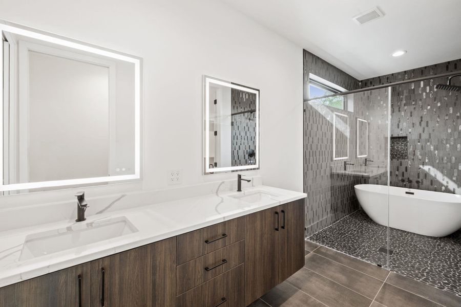 Floating cabinets at modern primary bathroom