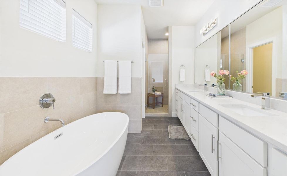 You're own private dual vanity bathroom awaits with large free-standing soaking tub