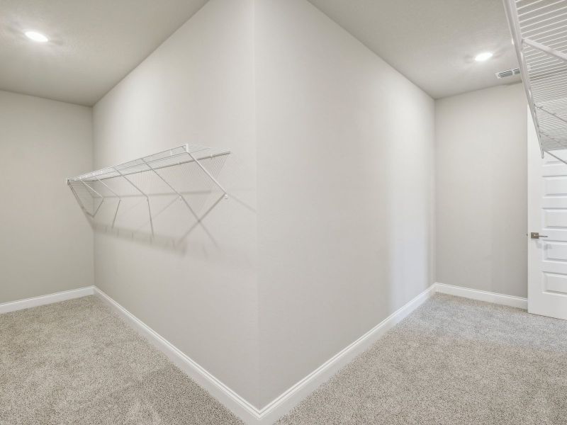 Primary Closet in the Onyx floorplan at 6406 NW Sweetwood Drive