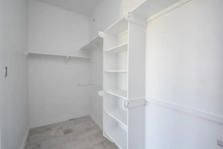 Primary Bedroom Closet has shelving and built-ins Primary Bedroom Closet has shelving and built-ins