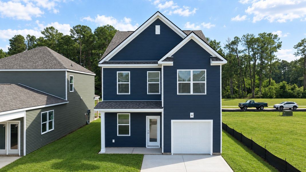 Front exterior of a new home in The Cove at Mallard Crossing, Summerville, SC, highlighting curb appeal (Image 2). Front exterior of a new home in The Cove at Mallard Crossing, Summerville, SC, highlighting curb appeal (Image 2).