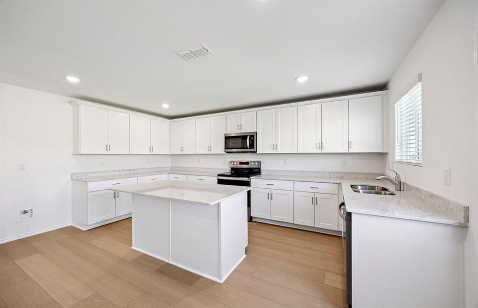 Spacious kitchen with eat-in bartop island Spacious kitchen with eat-in bartop island