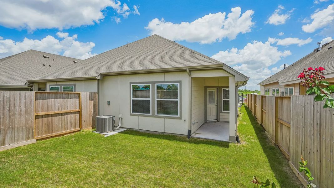 Exterior details and patio area of a home in Meridiana Townhomes, Iowa Colony (Image 4).
