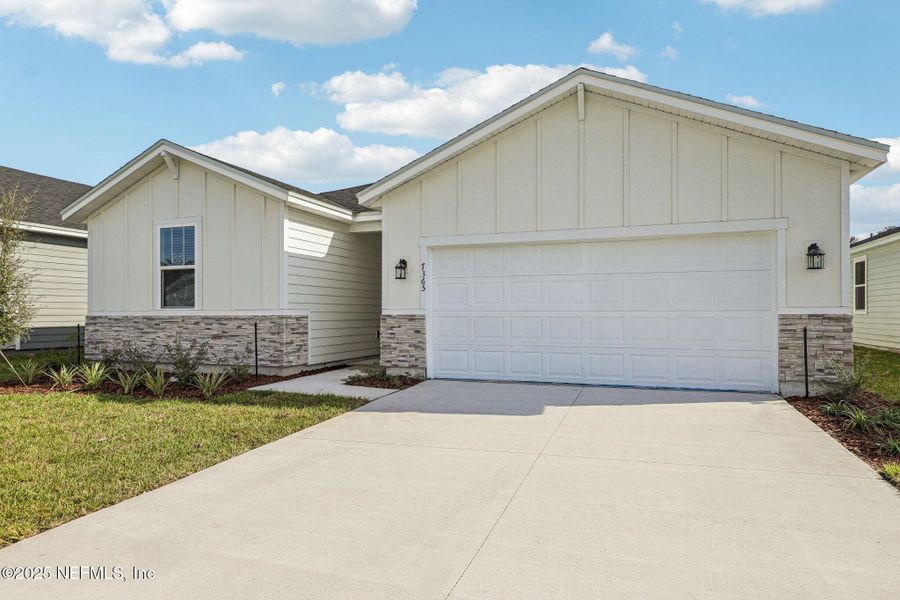 Front exterior of a new home in Cypress Meadows - Signature Series, Jacksonville, FL, highlighting curb appeal (Image 17).