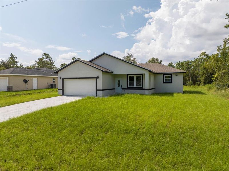 Front exterior of a new home in , Ocala, FL, highlighting curb appeal (Image 1). Front exterior of a new home in , Ocala, FL, highlighting curb appeal (Image 1).