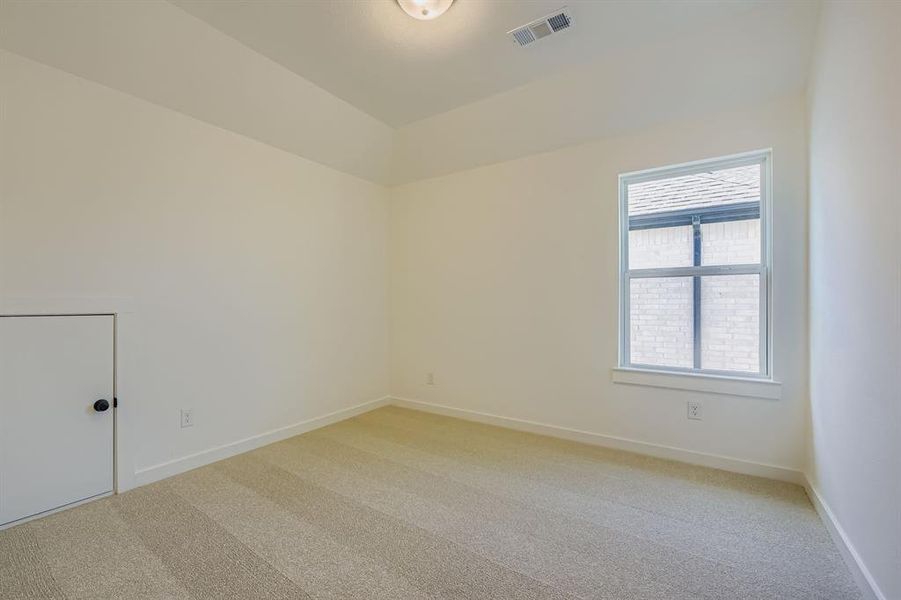 Empty room featuring light carpet Empty room featuring light carpet