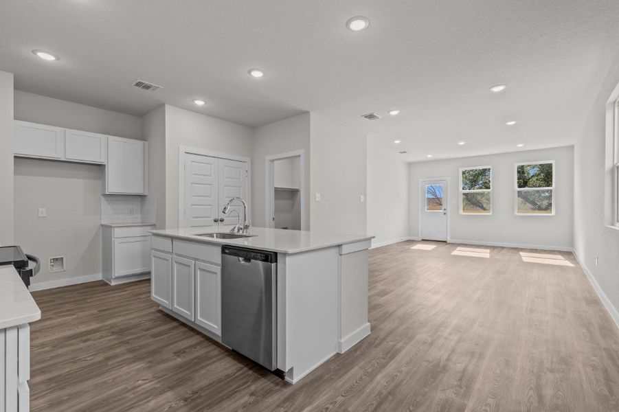 A kitchen with white cabinets. A kitchen with white cabinets.