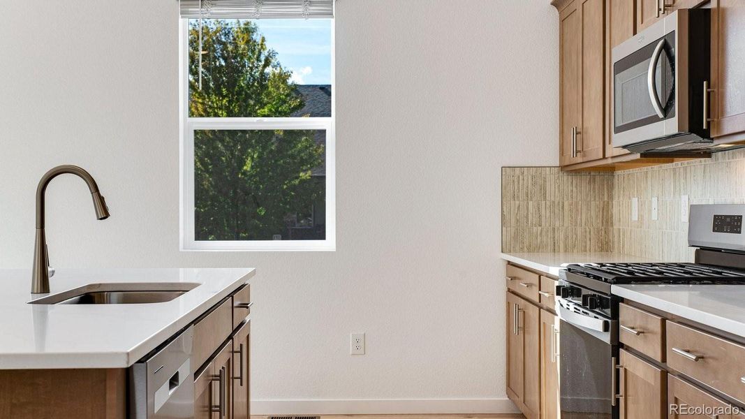 Furnished interior view inside a new home in Trails at Crowfoot, Parker (Image 9).