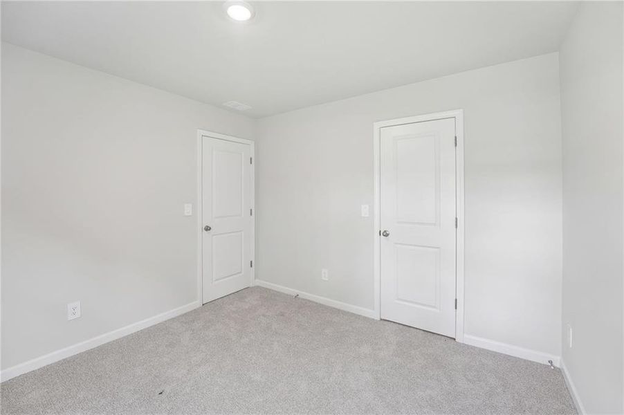 Spacious, unfurnished interior of a new home in Northwoods at Mirror Lake, Villa Rica (Image 32).