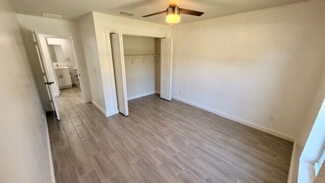 Primary bedroom with walkin closet