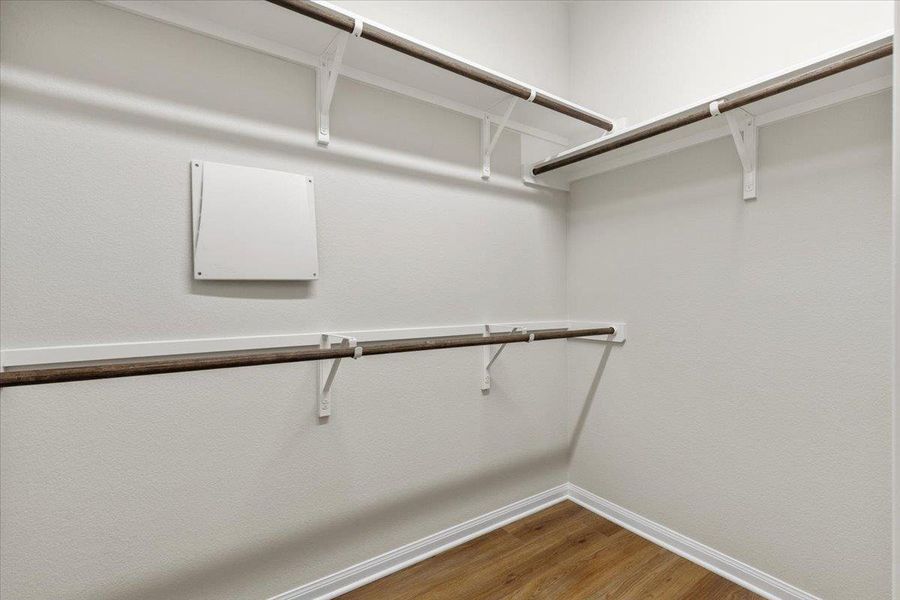 The primary walk-in closet is generously sized.