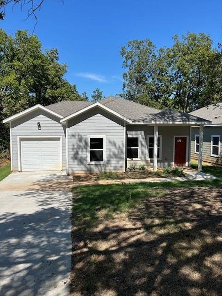 View of front of house with a garage, concrete driveway, and roof with shingles View of front of house with a garage, concrete driveway, and roof with shingles