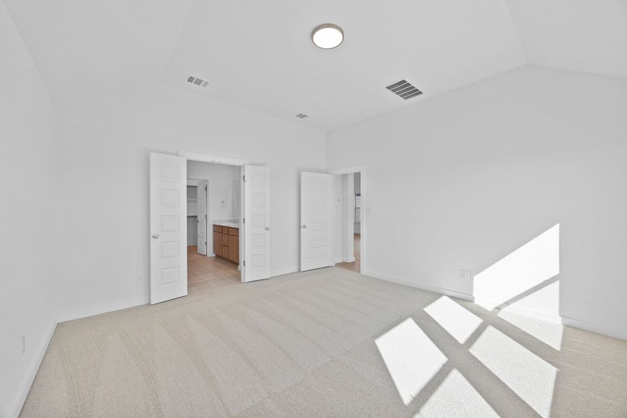 Primary Suite in the Quartz home plan by Trophy Signature Homes – REPRESENTATIVE PHOTO