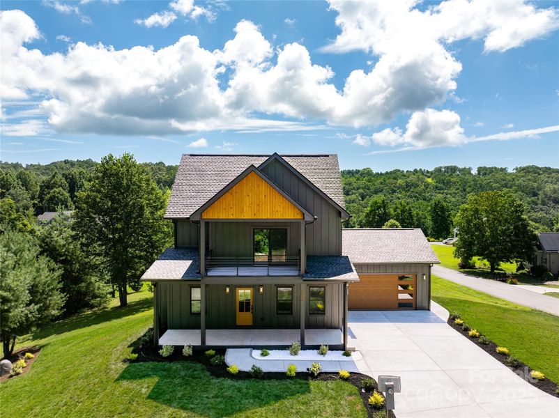 Front exterior of a new home in , Hendersonville, NC, highlighting curb appeal (Image 1).