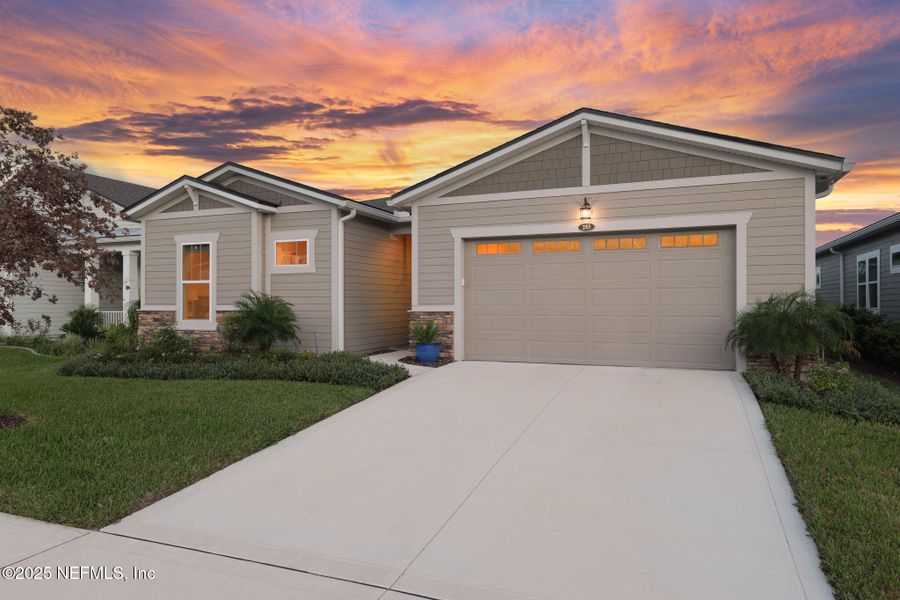 Front exterior of a new home in , St. Johns, FL, highlighting curb appeal (Image 1). Front exterior of a new home in , St. Johns, FL, highlighting curb appeal (Image 1).