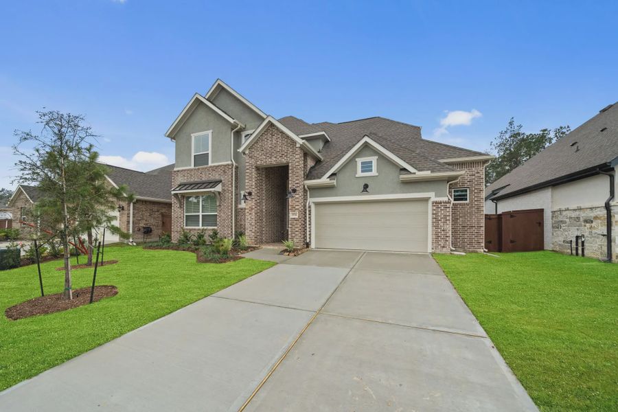 Front exterior of a new home in Evergreen, Fulshear, TX, highlighting curb appeal (Image 23).