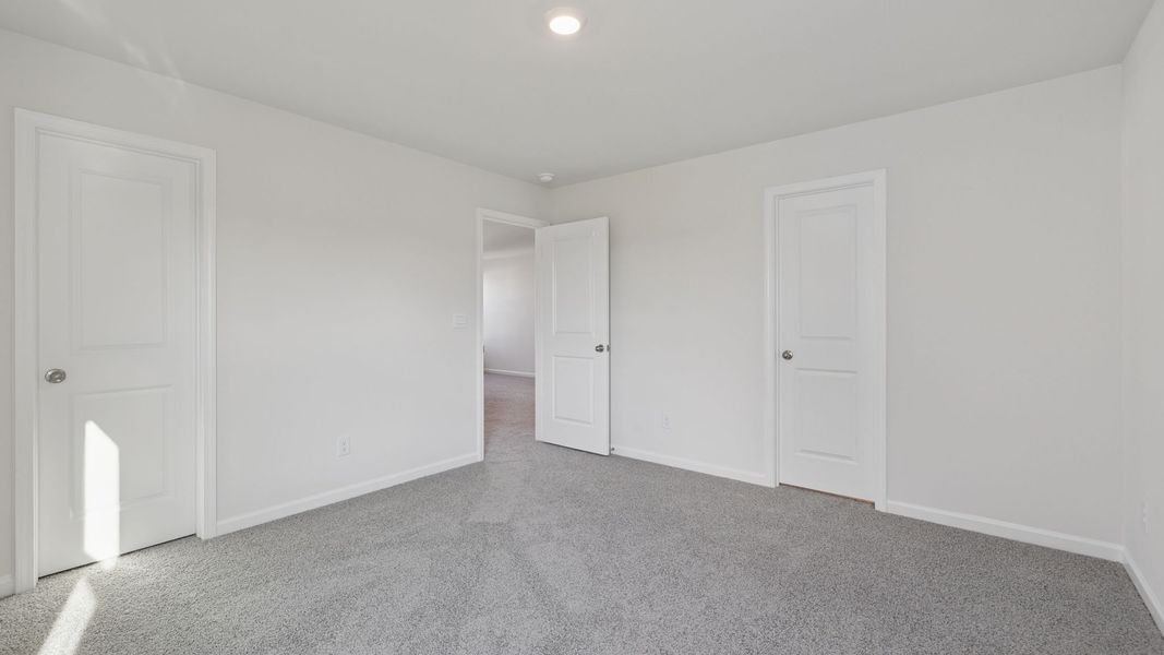 Spacious, unfurnished interior of a new home in Durbin Meadows Traditions, Fountain Inn (Image 23).