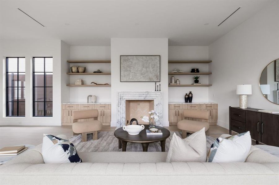 Living room featuring a fireplace and light wood-style flooring