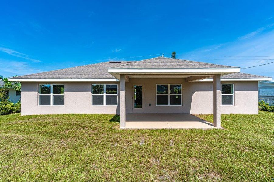 Front exterior of a new home in Bayshore, Port St. Lucie, FL, highlighting curb appeal (Image 1). Front exterior of a new home in Bayshore, Port St. Lucie, FL, highlighting curb appeal (Image 1).
