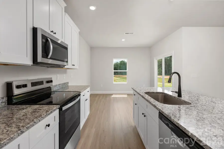 Furnished interior view inside a new home in Ascot Woods, Charlotte (Image 4).