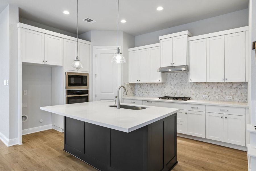 Furnished interior view inside a new home in 6 Creeks, Kyle (Image 4).