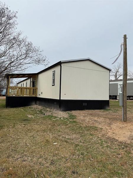 Exterior details and patio area of a home in , Pelican Bay (Image 16).