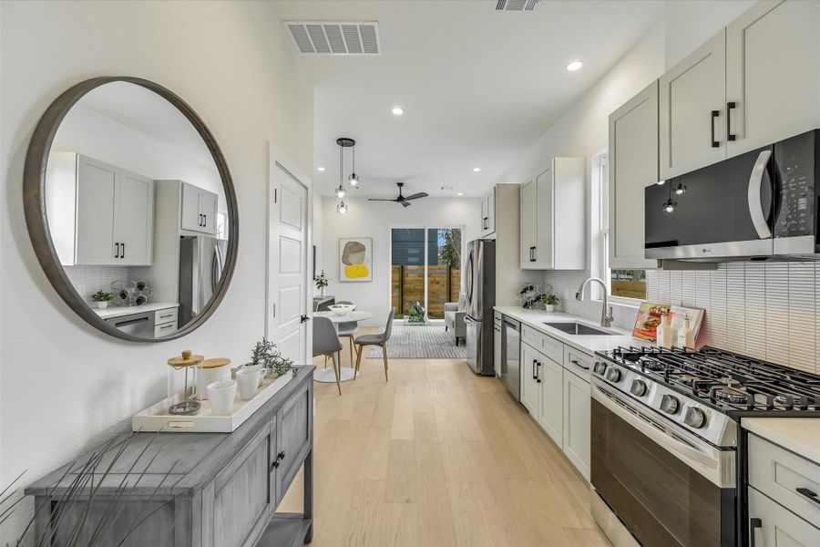 The professional gas range and deep stainless sink make it a dream for both the home chef and the weekend entertainer.