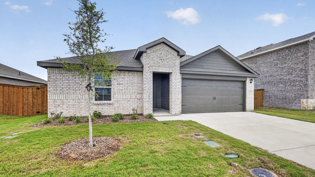 Front exterior of a new home in Forestbrook Estates, Paris, TX, highlighting curb appeal (Image 2). Front exterior of a new home in Forestbrook Estates, Paris, TX, highlighting curb appeal (Image 2).