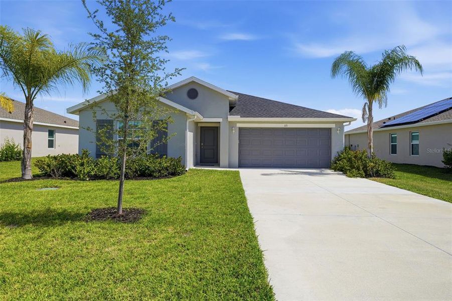 Front exterior of a new home in Rotonda Lakes, Rotonda West, FL, highlighting curb appeal (Image 1). Front exterior of a new home in Rotonda Lakes, Rotonda West, FL, highlighting curb appeal (Image 1).
