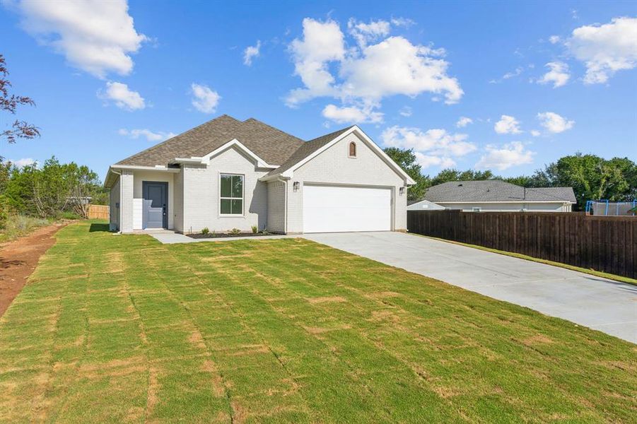 Front exterior of a new home in , Granbury, TX, highlighting curb appeal (Image 2). Front exterior of a new home in , Granbury, TX, highlighting curb appeal (Image 2).